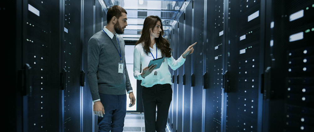 Two people in a server room